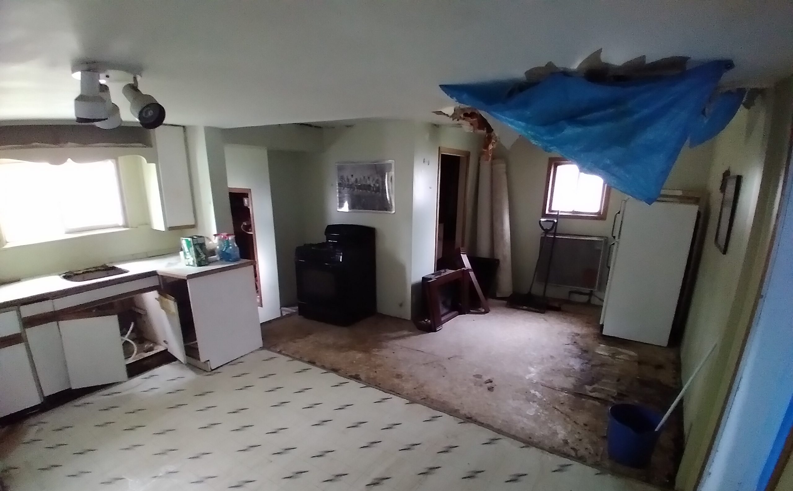 kitchen in condemned home before cash home buyer transformed it for resale